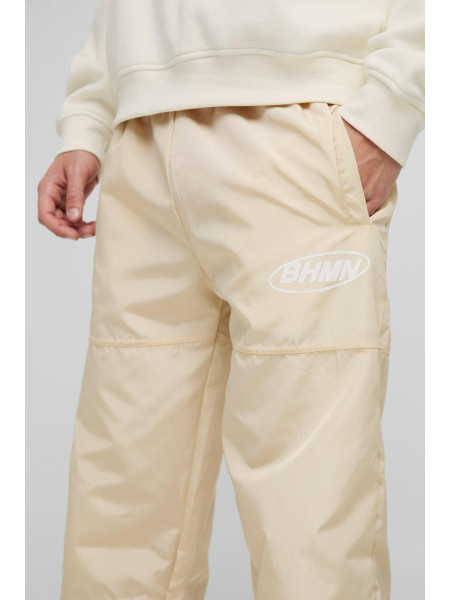 Розслаблені нейлонові фірмові штани з еластичною талією