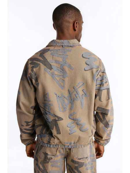 Денім-бомбер з принтом у стилі графіті