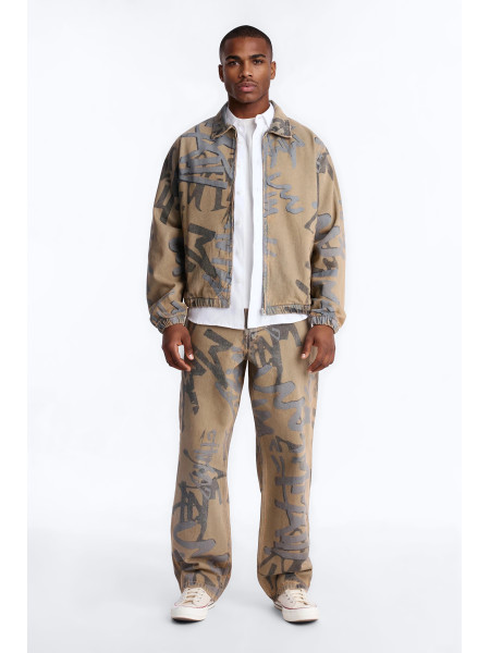 Денім-бомбер з принтом у стилі графіті