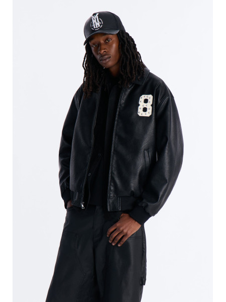 Чорна шкіряна куртка-бомбер з шипами