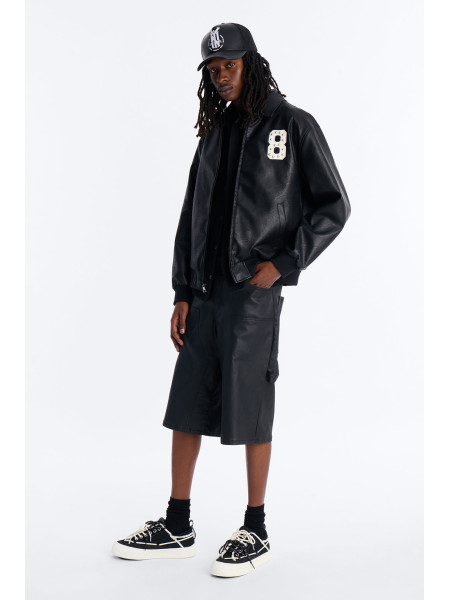 Чорна шкіряна куртка-бомбер з шипами