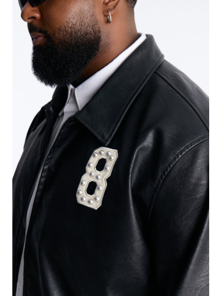 Чорна шкіряна куртка-бомбер з шипами