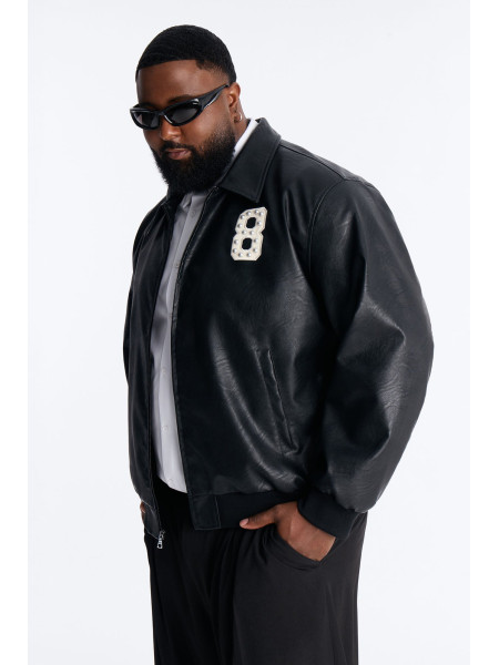 Чорна шкіряна куртка-бомбер з шипами