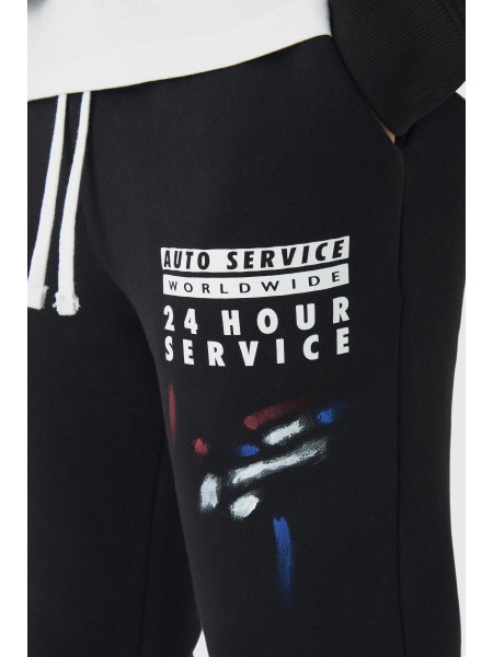 Тонкий джоггер із відблисками бризок фарби