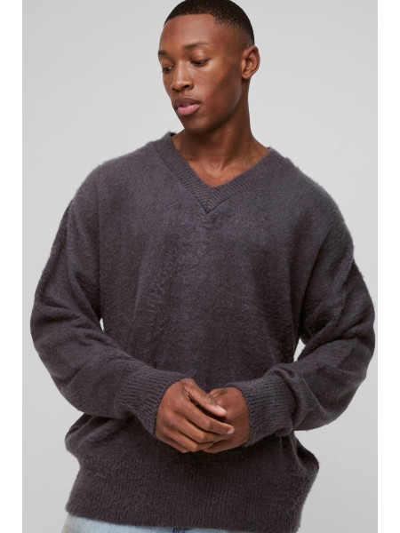 Величезний трикотажний джемпер із запущеними плечима та V-подібним вирізом