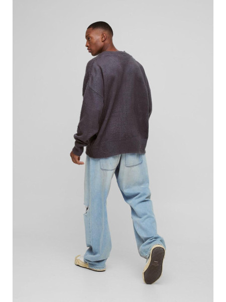 Величезний трикотажний джемпер із запущеними плечима та V-подібним вирізом