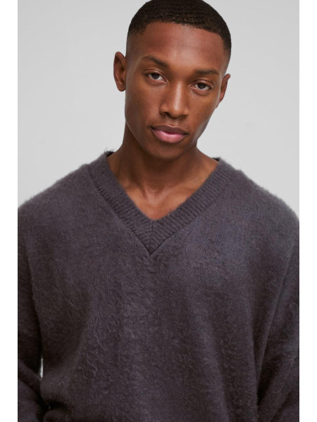 Величезний трикотажний джемпер із запущеними плечима та V-подібним вирізом